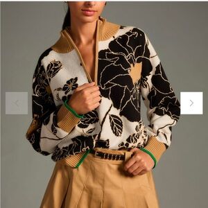 Anthropologie sweater with a zipper. Colors - black, white, tan and green.